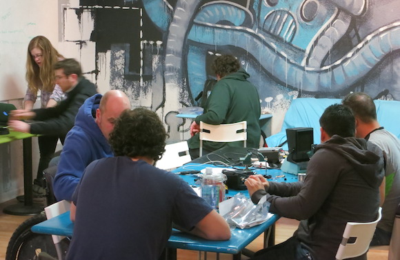 People learn to solder at a hack class at The Concoctory.