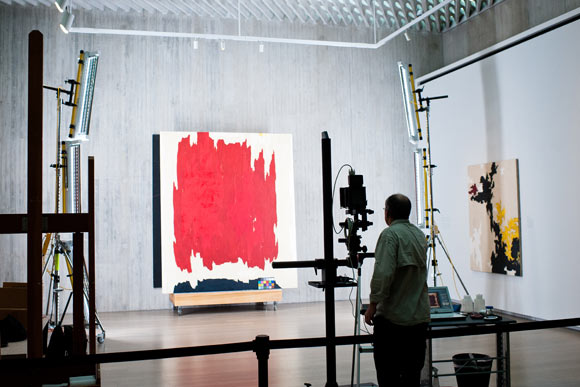 A Clyfford Still painting being photographed and catalouged.