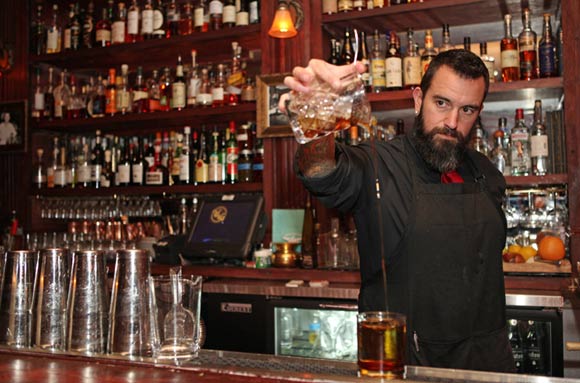 A bartender at Williams and Graham creates a cocktail. 