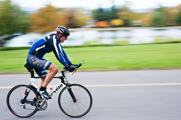 A cyclist bikes through Washington Park.