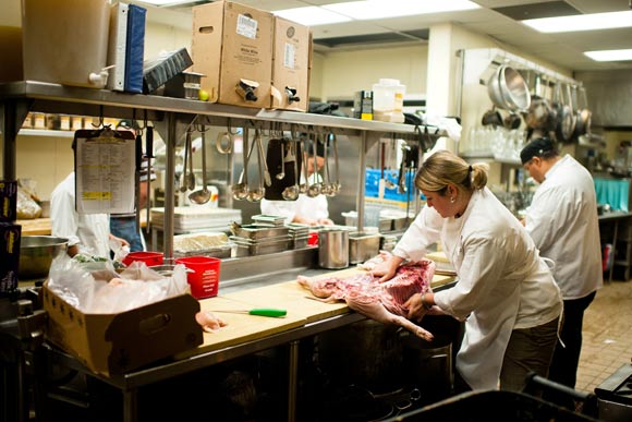 Panzano's Executive Chef Elise Wiggins butchers a pig.