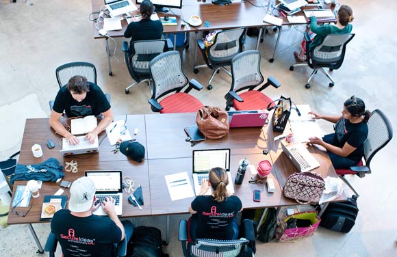 Various startups work in The Atrium at Galvanize.