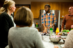 Dennis Taylor, program coordinator, teaches a signature cooking class.