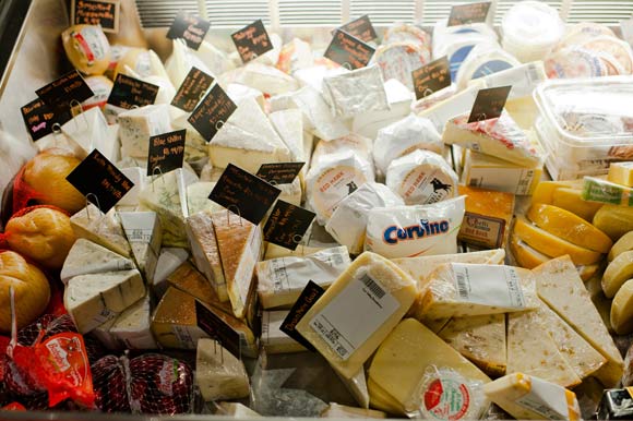 Mondo Market offers a collection of cheeses and specialty foods.