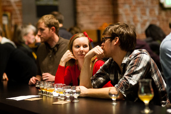 A couple enjoys flights of beer at Crooked Stave Artisan Beer Project.