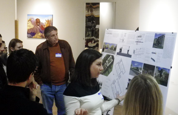 Korey White of Park21 Architecture explains her design to the judges.