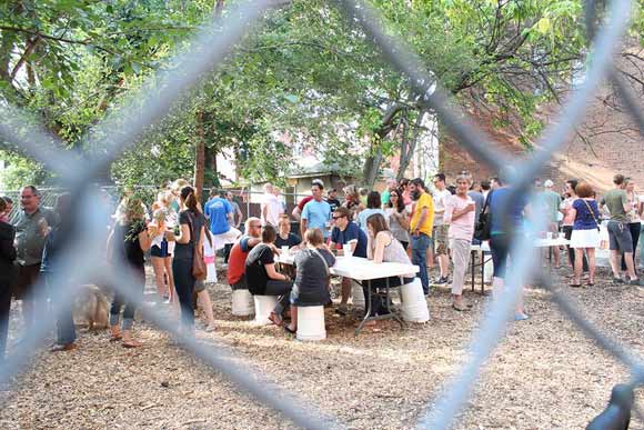 Cleanup volunteers enjoy a pop-up beer garden in Five Points Alley in Cincinnati.