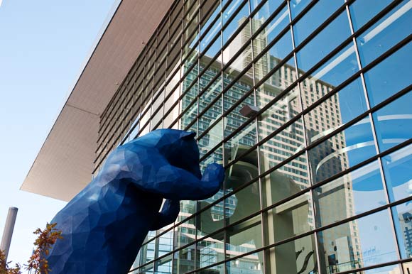 Lawrence Argent's "I See What You Mean," a.k.a. The Big Blue Bear, peers into the convention center.