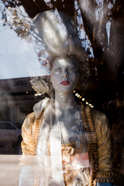 A mannequin stares out of Rebelle Salon. 