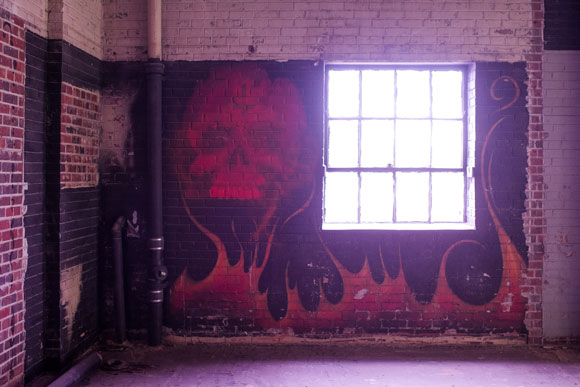 A motorcycle club met in the warehouse when it was vacant, and they left their mark.