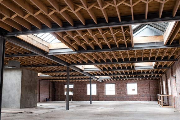 The site includes the largest remaining undeveloped exposed brick-and-timber warehouse in Denver.