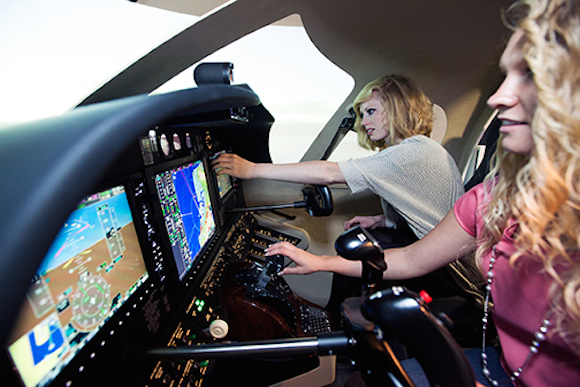 MSU Denver students practice on flight simulator.
