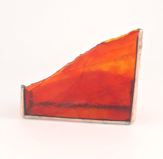 Red-stained glass-art business card holder.