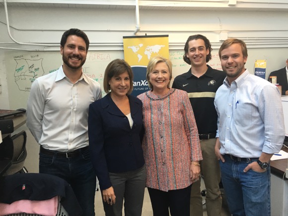 The PanXchange team poses with Clinton.