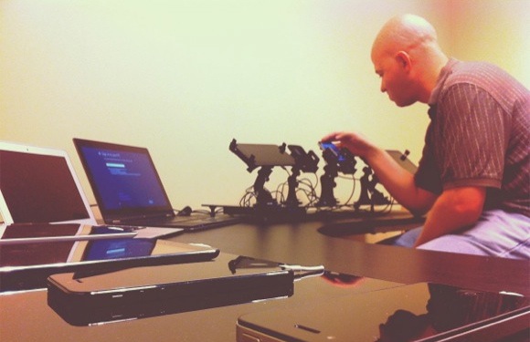 A staffer tests mobile apps in the ProtoTest lab.