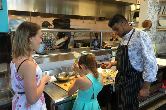 Dave teaches Isabella and Sofia Naccarato (owner Whitney Ariss' nieces) how to make samosas.