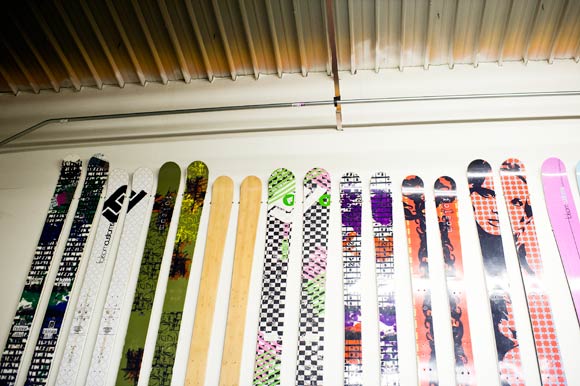 Pairs of skis line the wall at Folsom's warehouse in Denver.