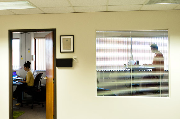 Eric Daughtry, right, and Danielle Reubenstein work in their offices at Xcellent Creations.