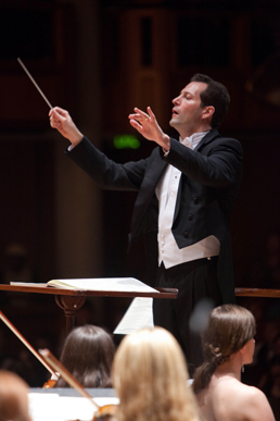 A conductor with the Lamont Symphony Orchestra at the University of Denver.