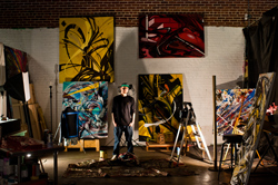 Jolt, a Denver graffiti artist, poses in his studio space. 