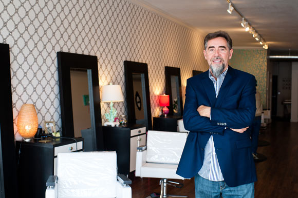 Developer Jon Cook poses in Blo Salon.