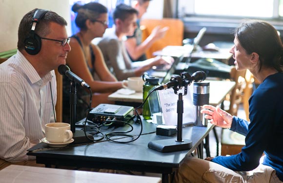 Dan Drayer talks with Anja Koltes at St. Mark's Coffee House.