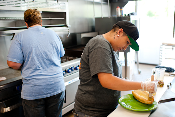 Women cook on the link at the Osage Cafe. 