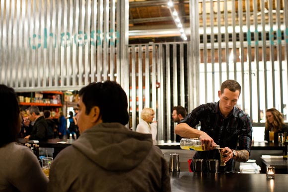 A bartender mixes up a drink at the CapRock Farm Bar.