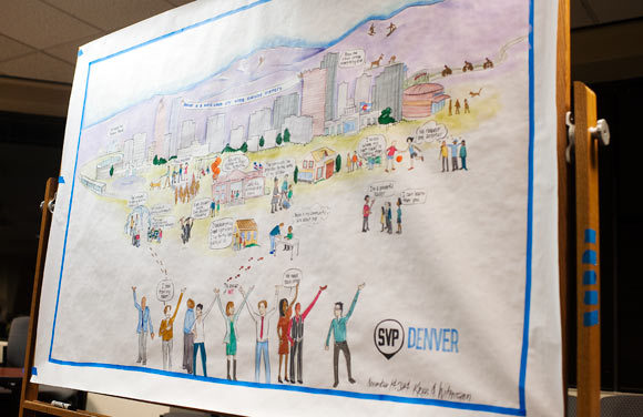 A mural is the backdrop at one of Social Venture Partners' meetings.