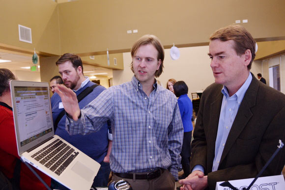 Senator Bennet talks with James Olander, founder of The Roost.