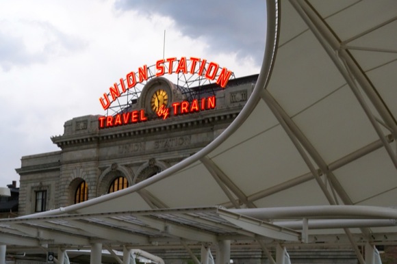 The canopy on the rail platform harks to the architecture at Denver International Airport.