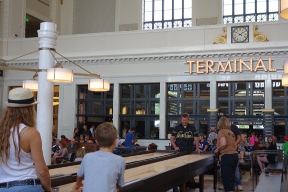 In the Great Hall, shuffleboard play gets serious on opening day.