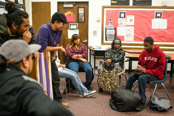 A student freestyles in class as the teachers beatbox.