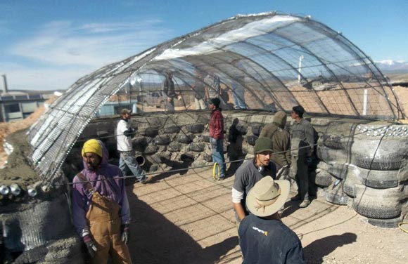 Earthships are curvy, curious structures -- half kiva, half greenhouse, both high and low tech.