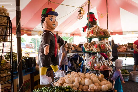 Piñatas hang at Peña Produce stand.