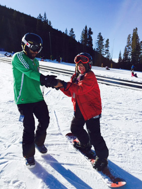 Ivan Sherpas working one-on-one with a student with autism from the I Have A Dream foundation, Sam.