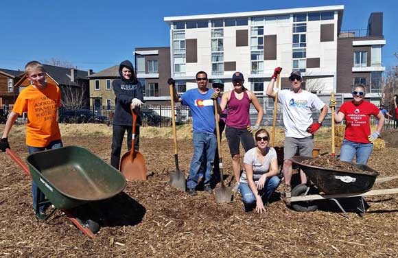 Groundwork Denver volunteers work at a park. 