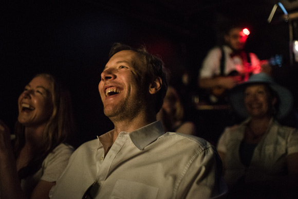 Movie goers laugh during "Alice in Wonderland."