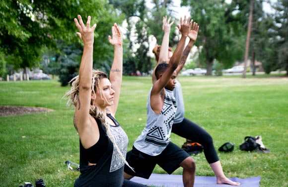 The Cappello's team practices yoga.