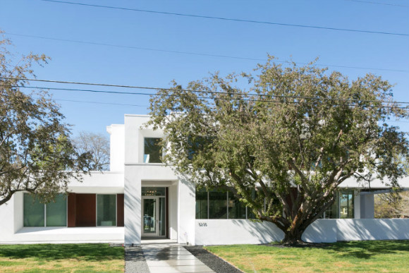 The modern Hilltop home features a covered patio.