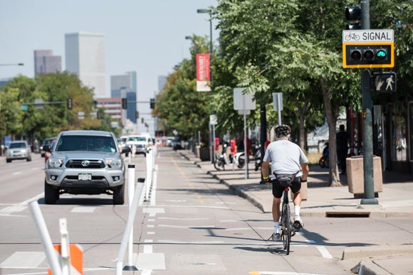 The lanes include stoplights for bikes and enhanced stoplights with left turn signals for vehicles.