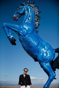 DIA Director of Arts and Public Events Heather Kaufman stands before "Mesteño/Mustang."