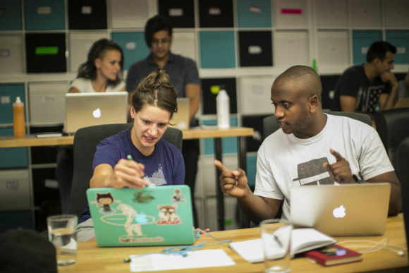 Marlo Major (right) confers during a Turing School class.