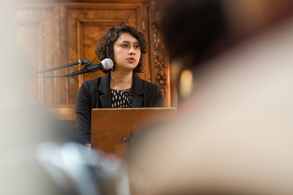 Raksha Vasudevan reading one of her pieces at "Writer's Resist."