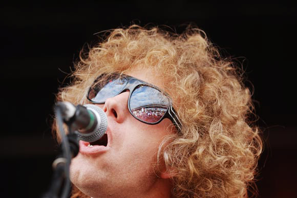 A musician plays at a local music festival.