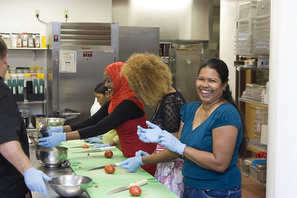 A class meets in the Fritz Knoebel School of Hospitality Management.