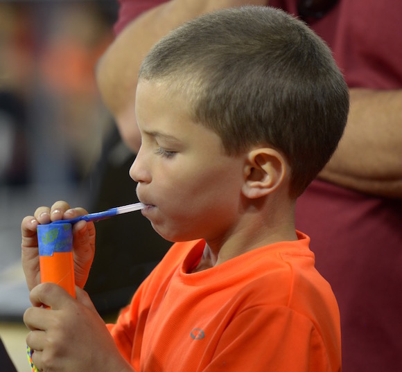 A child learns through a RAFT kit.