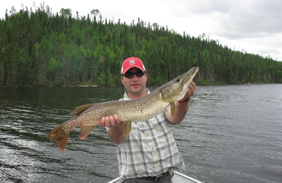 TrackVia CEO Pete Khanna displays an enormous Northern pike.